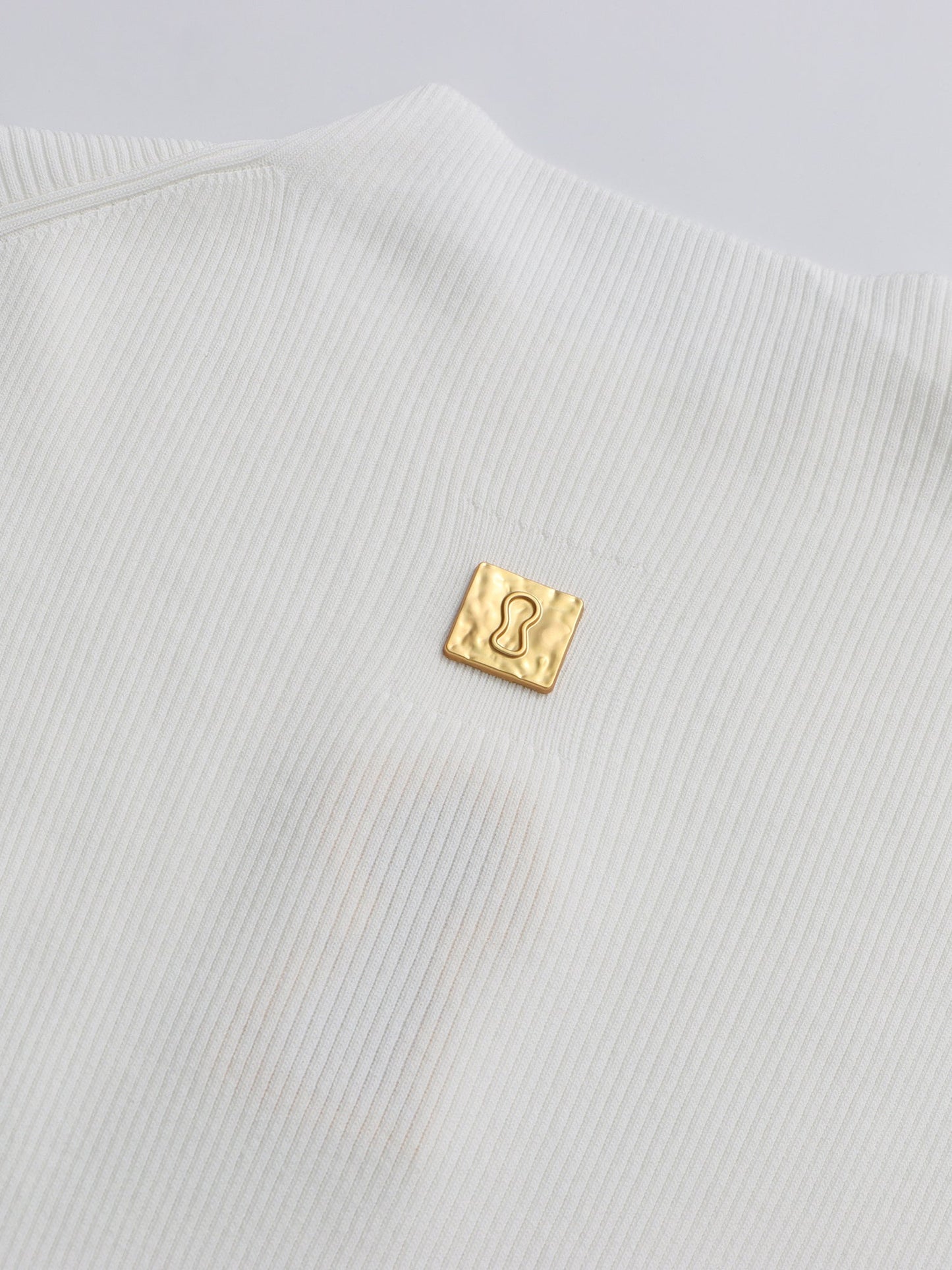 White Ribbed Knit Sweater with Gold Embellishment